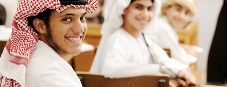 Group of Arabic students with eastern traditional clothes in classroom.